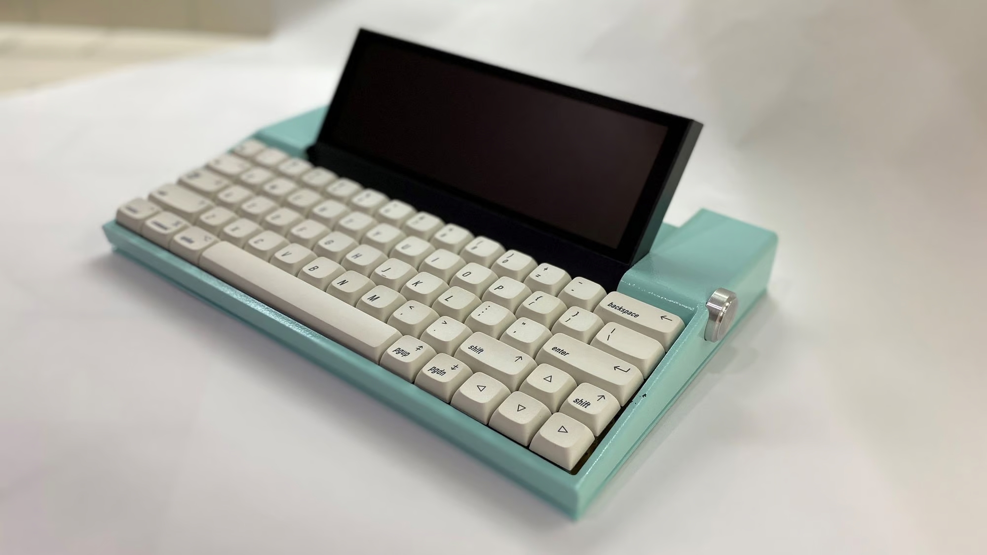 The Andrium Digital Typewriter, baby blue with cream colored keys